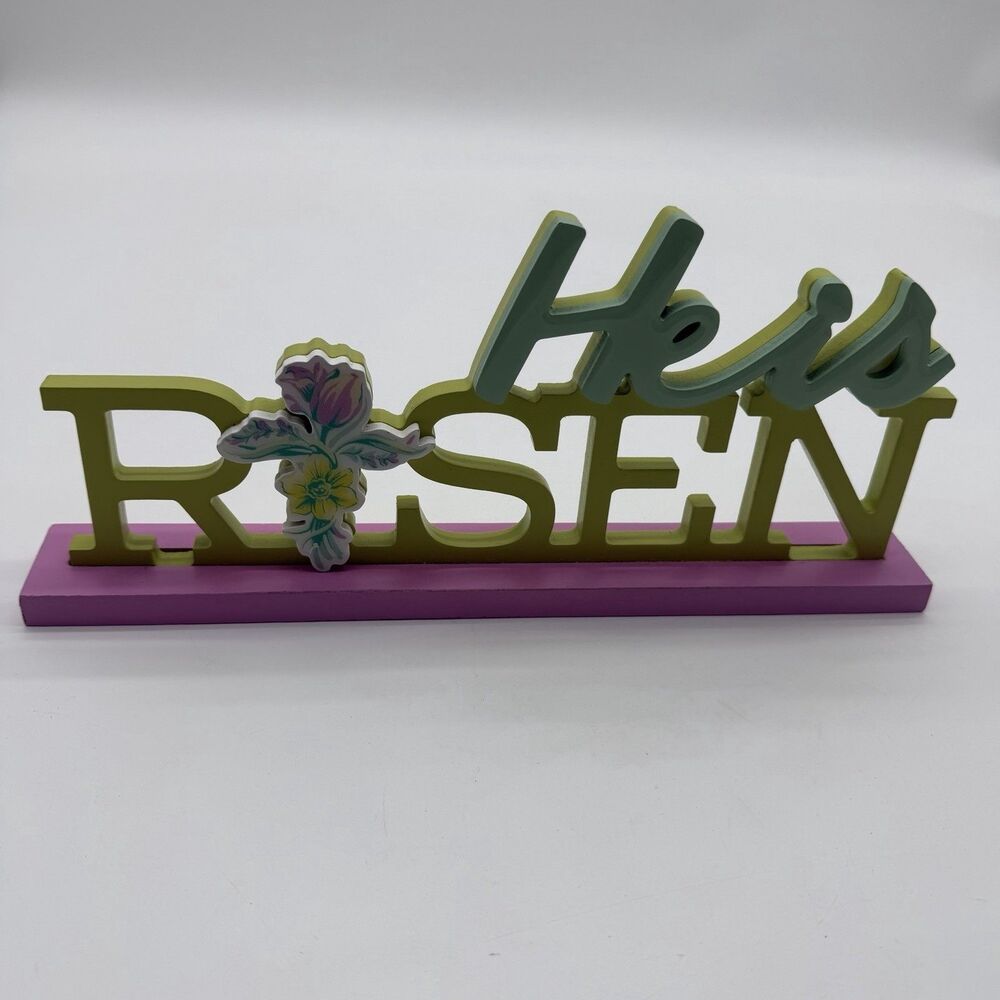 "He is Risen" table sign floral cross accent resting on purple base Wood Craft